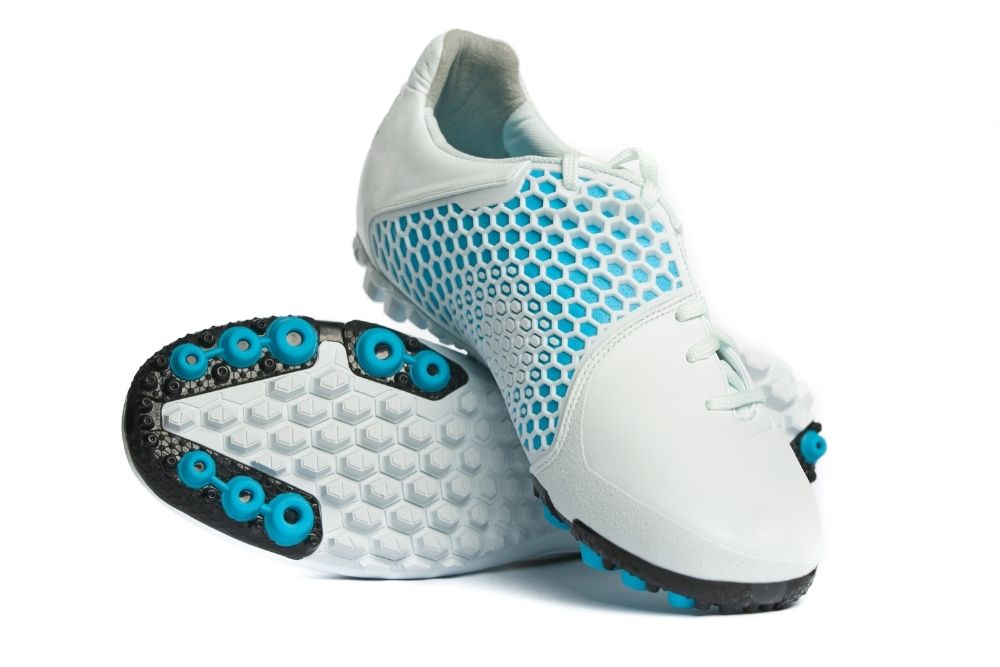 the outsoles of turf shoes with many studs