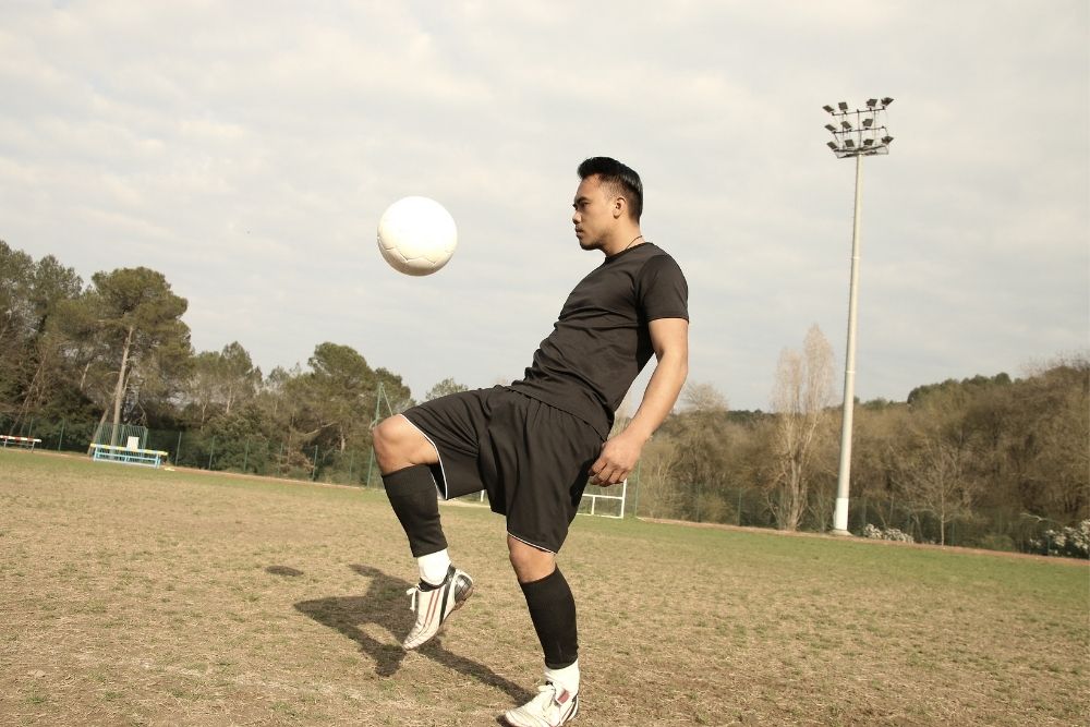 A player is juggling a soccer ball