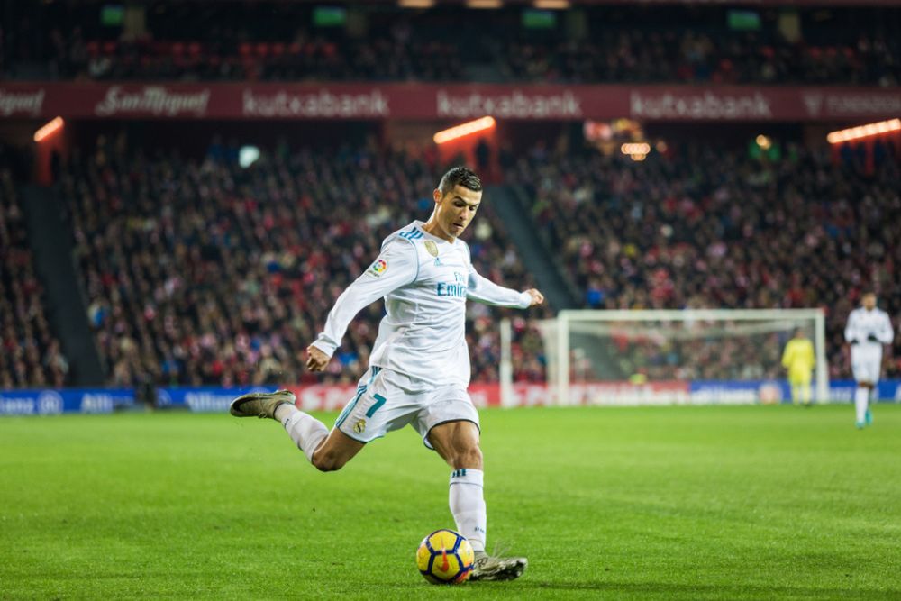 Ronaldo is kicking the soccer ball