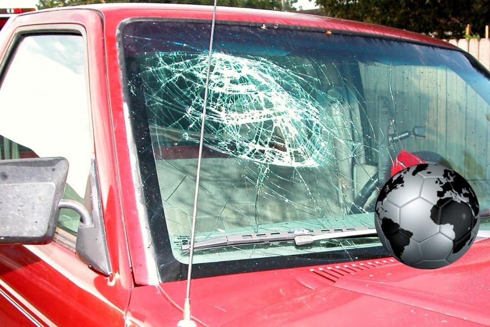 The soccer ball broke the car windshield 