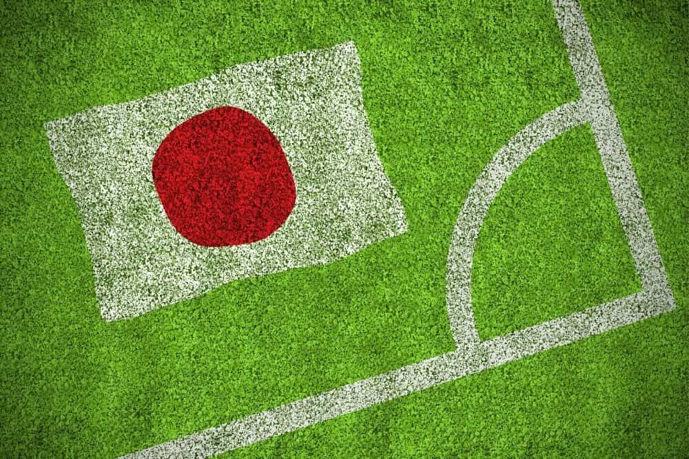 a Japan flag is printed on the soccer field