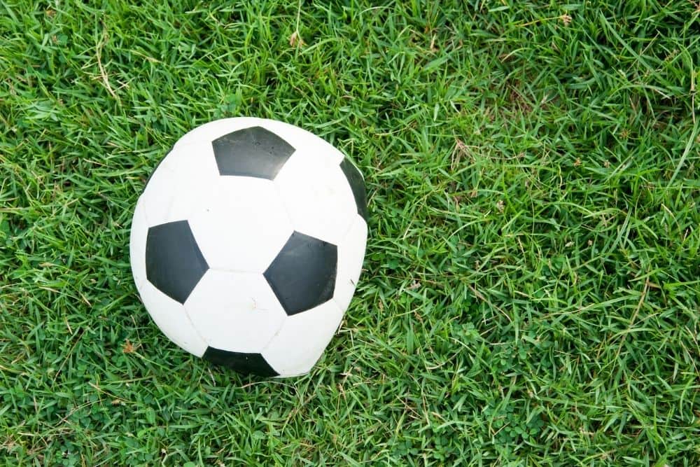 a soccer ball is deflated on the field