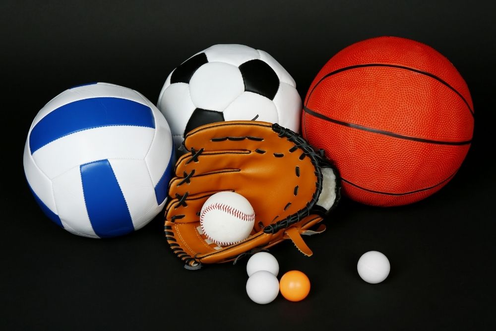 there are several balls including table tennis ball, soccer ball, baseball, volleyball, basketball