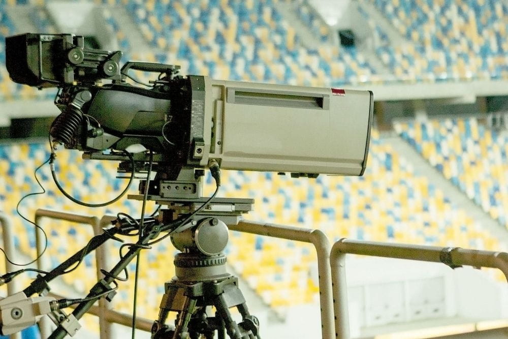 A camera is placed in the stand of a stadium