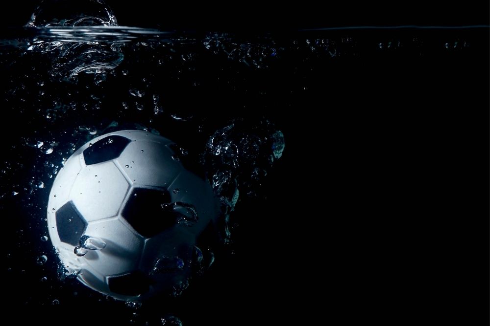 A soccer ball submerged in water