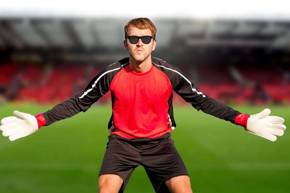 a goalkeeper wears sunglasses