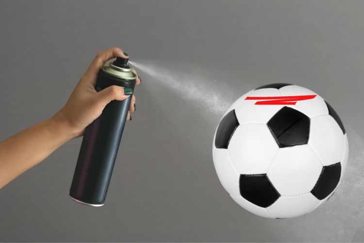hair spray and soccer ball with pernament marker
