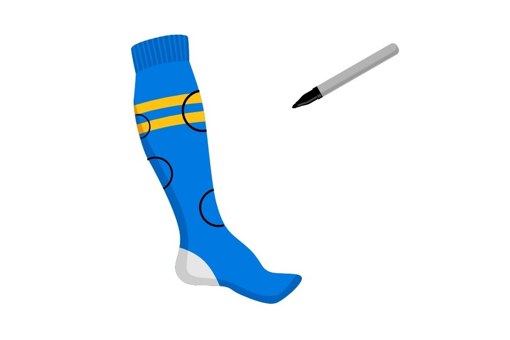 use a marker to draw circles on blue soccer socks