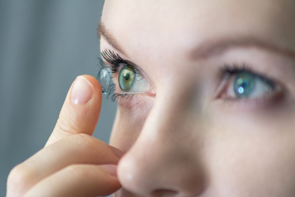 woman wears soft contact lenses
