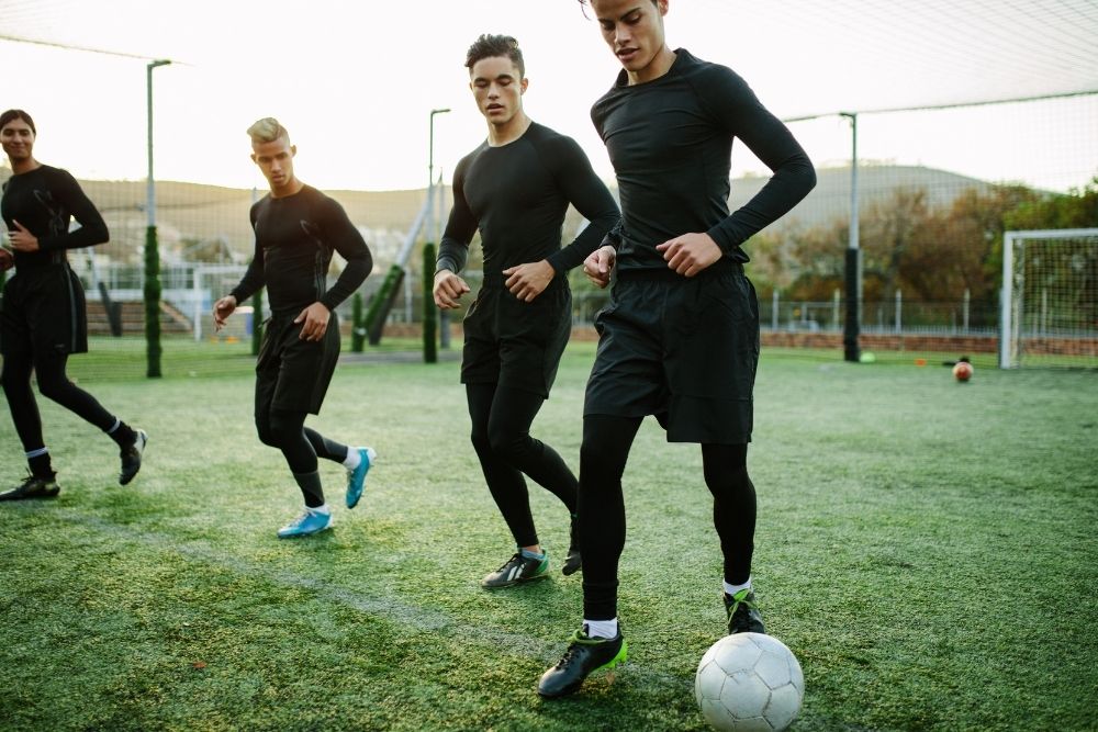 Soccer players are training with a ball