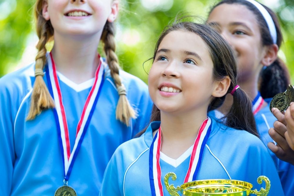 Young girl soccer team get an award