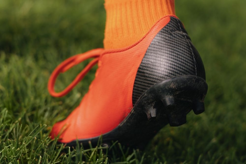 a foot wearing new soccer cleat