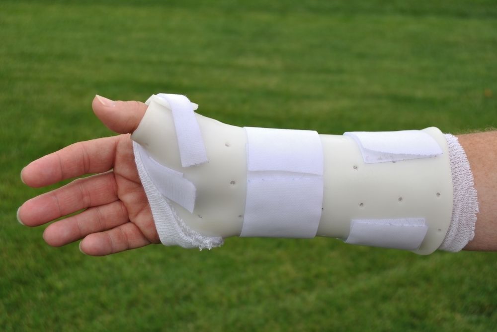 a person with an arm brace on the field