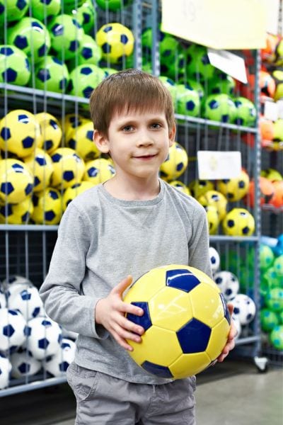 A kid in the soccer store