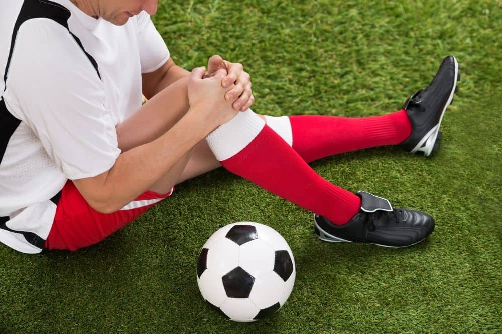 A soccer player is getting a Knee Injuries