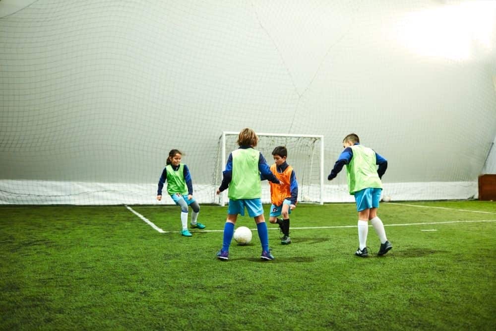 An indoor soccer match of the children