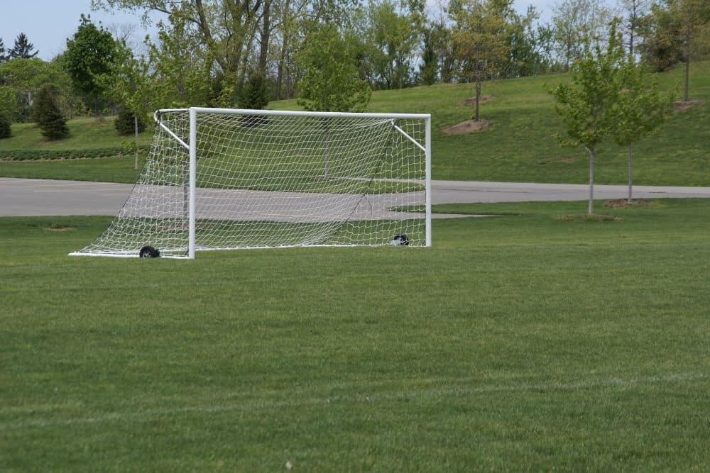 a soccer net is anchored by Portable ground anchors method