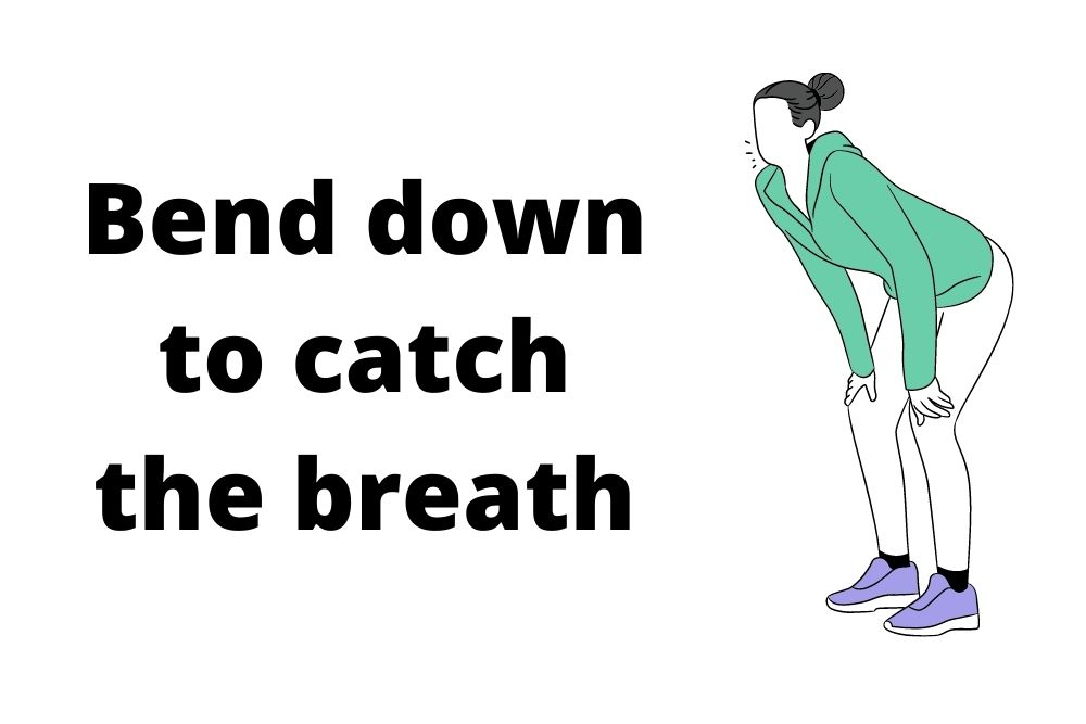 girl bends down to catch her breath
