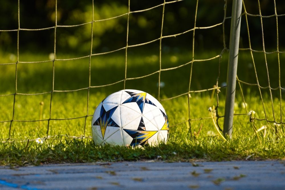 soccer ball in soccer goal net