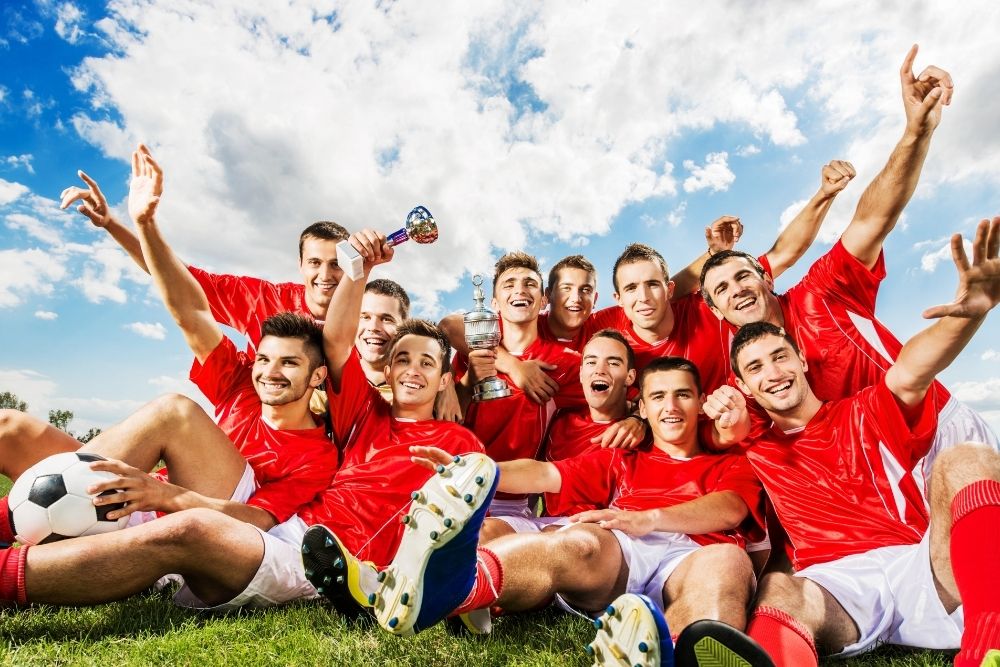 soccer team with 11 soccer players wearing red jerseys