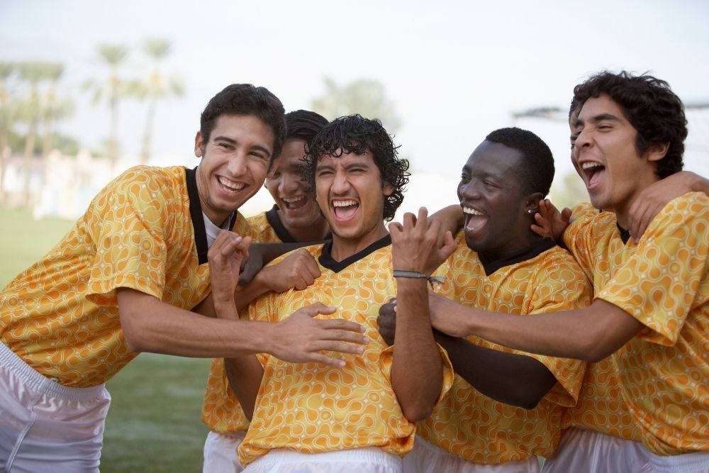 Soccer players celebrate victory