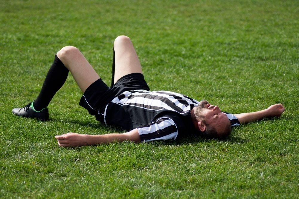 Soccer player tired on the field