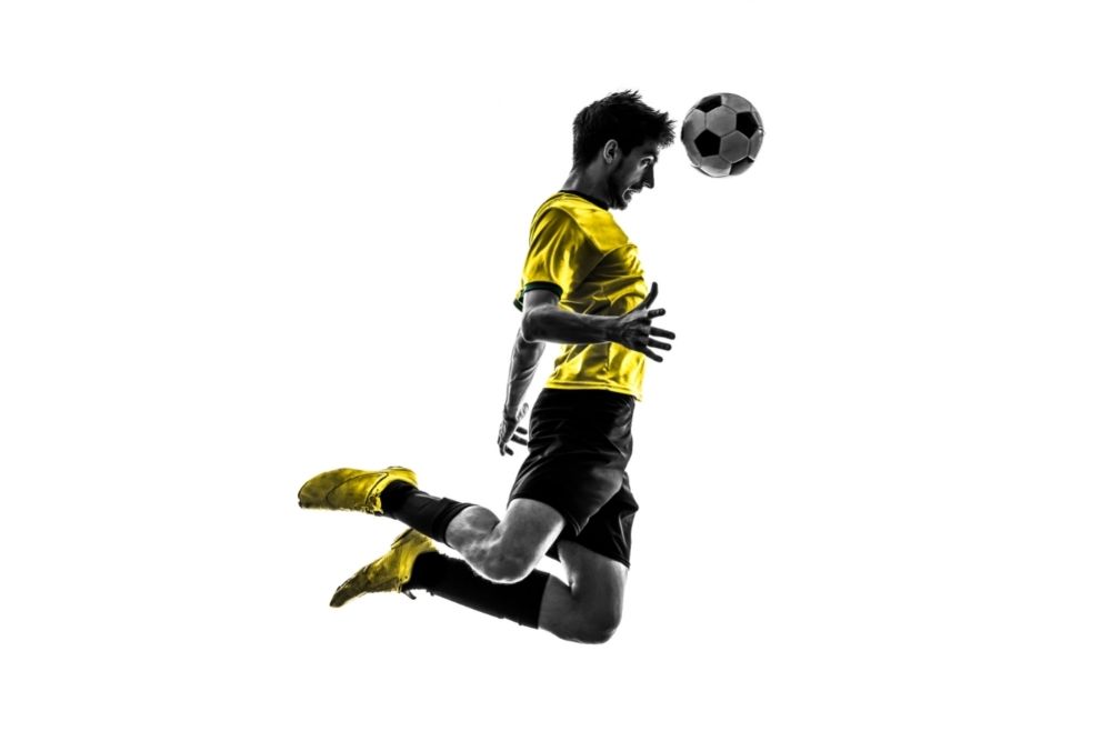 Soccer player use his head to hit the ball