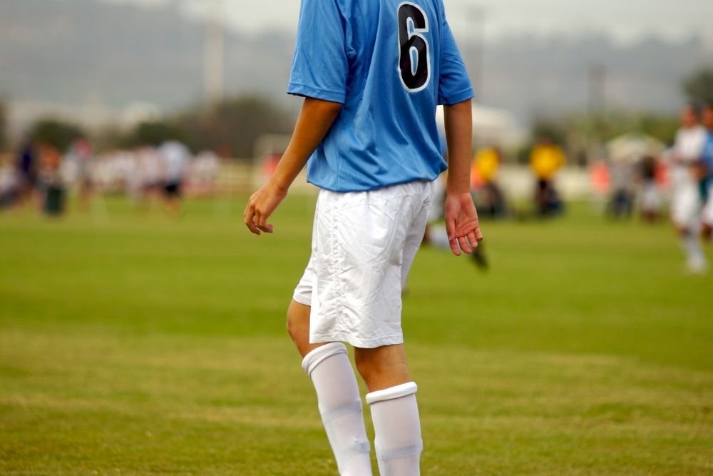 Soccer player walking on the field
