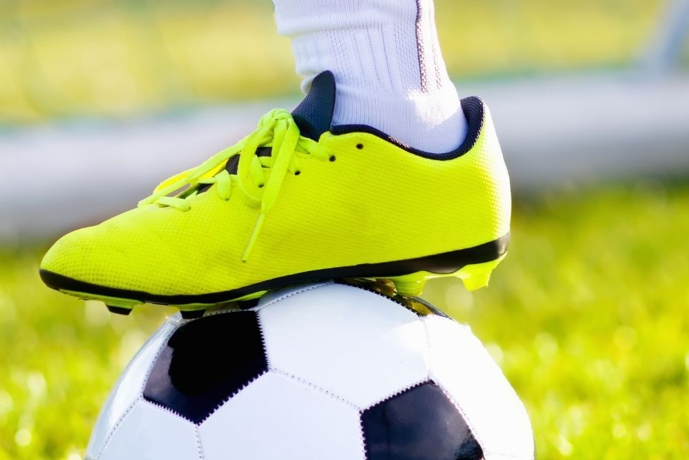 Synthetic soccer cleat