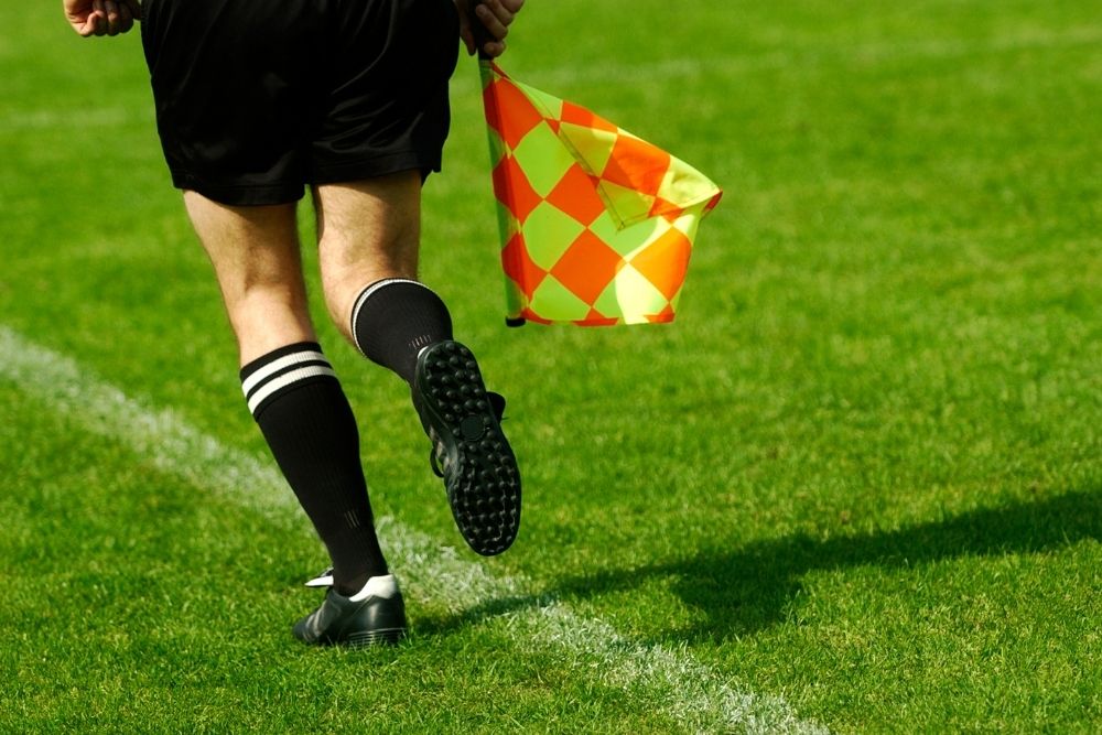 a soccer referee is running