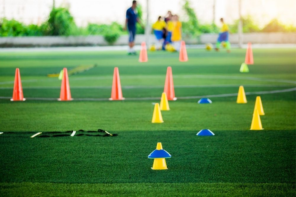 cones are placed around the field to play minefield with soccer ball
