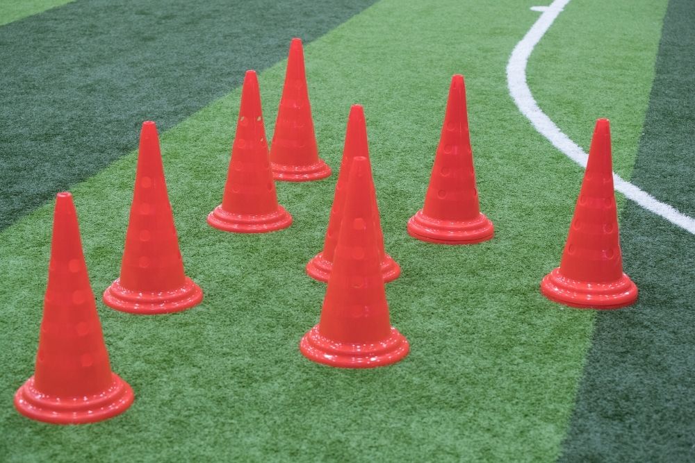 gather many cones in a place to play soccer bowling