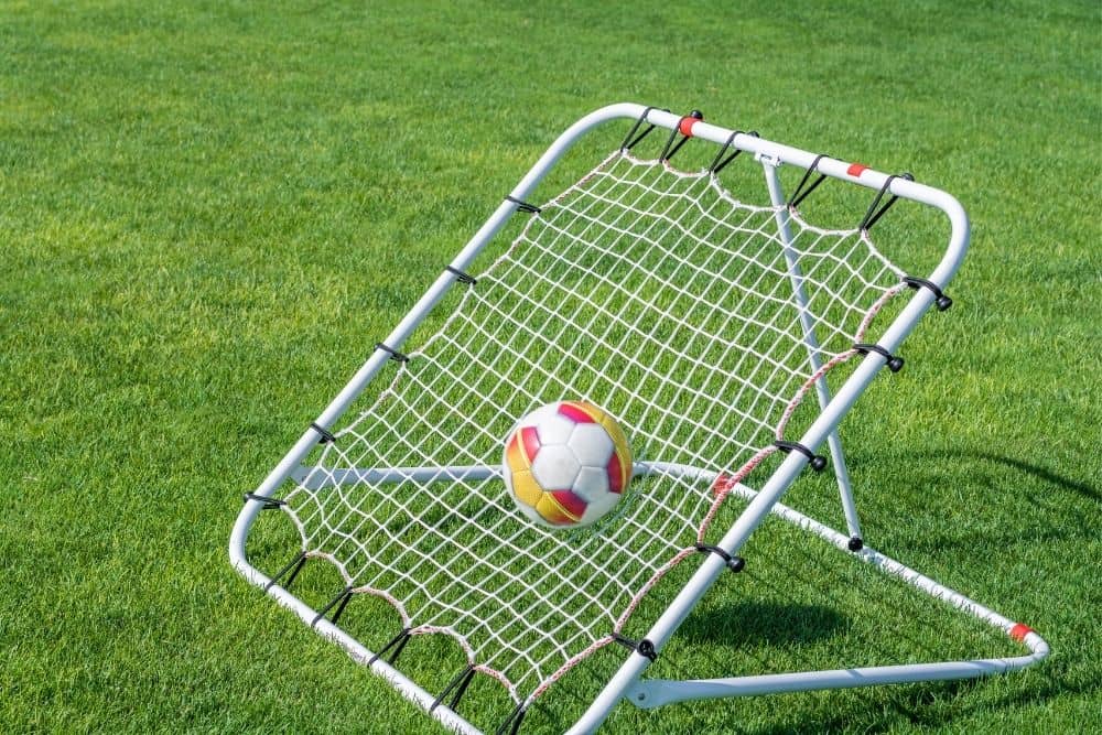 taut net hung on a metal frame as a soccer rebounder