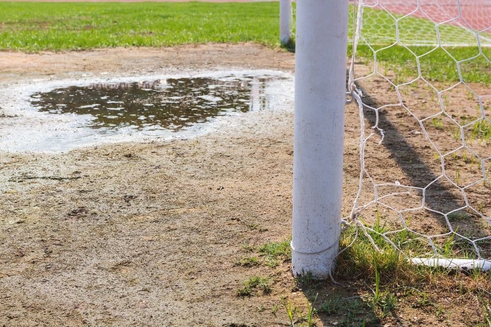 Soccer with the puddle in front of the goal