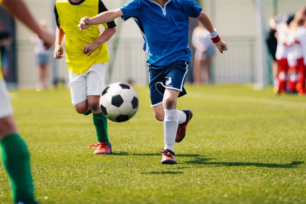 Young soccer players on the field