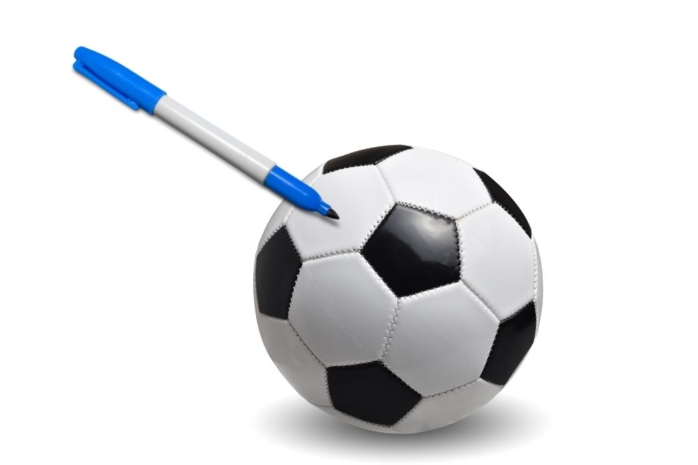 marking soccer ball with a blue pernament marker