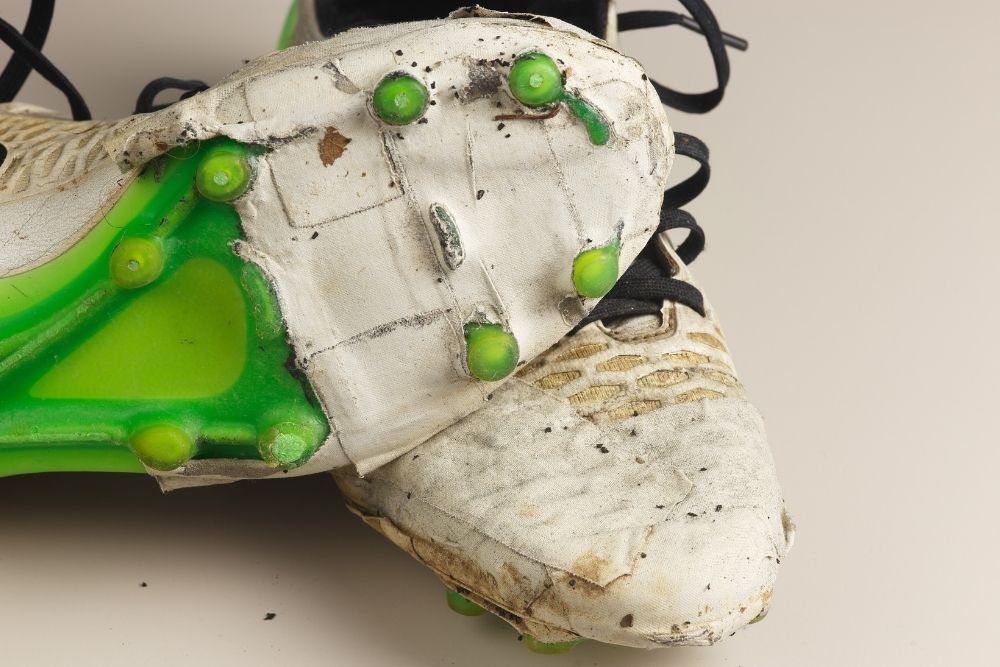 old white soccer cleats abandoned for a while