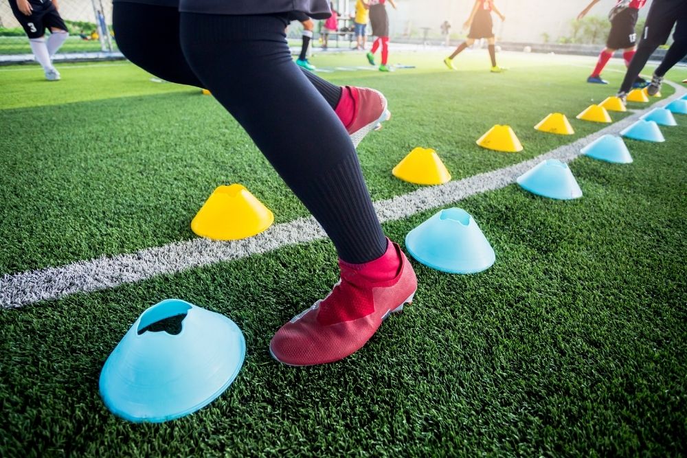 soccer practice with yellow and blue cones