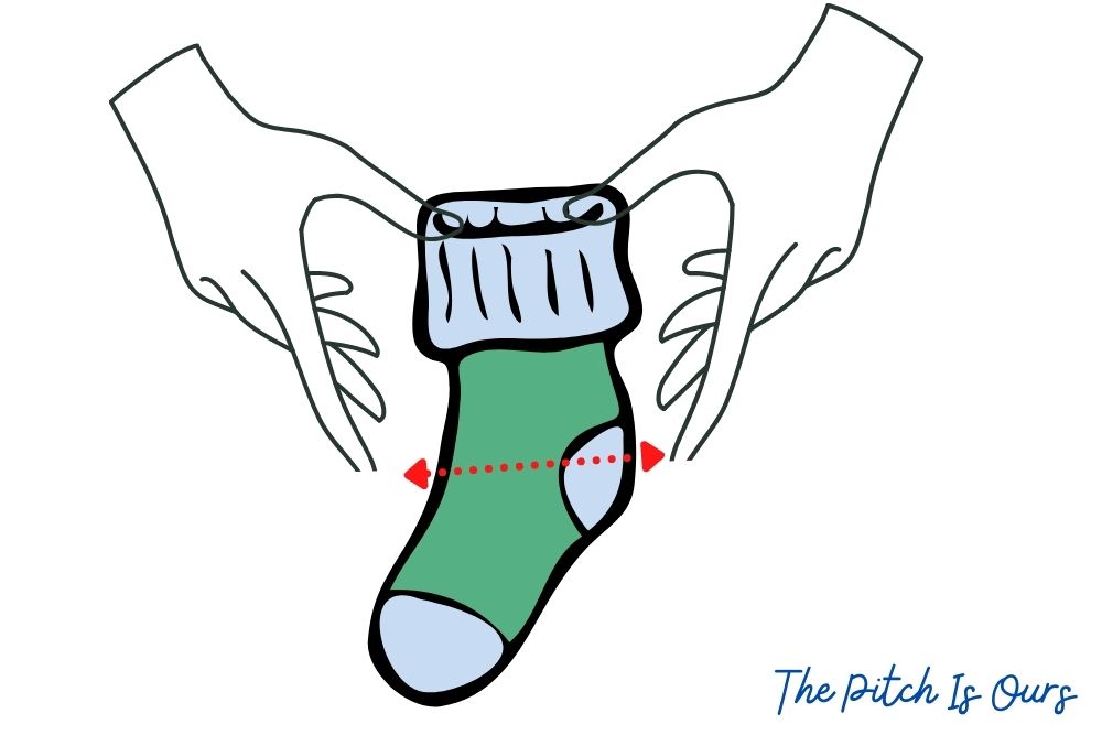 stretch soccer socks by cuffing and pulling the instep to heel