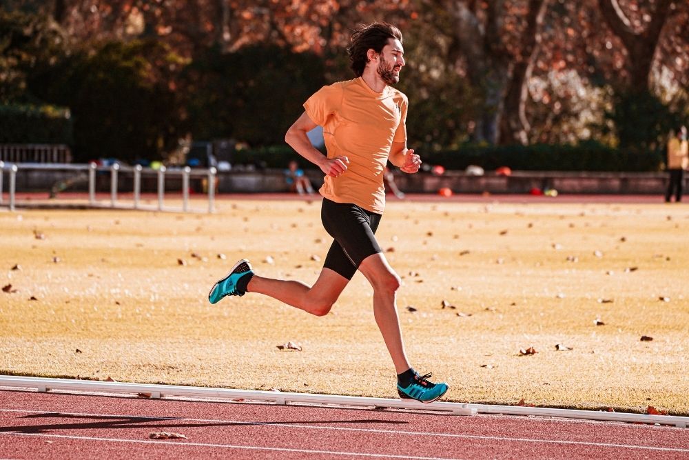 man practicing running killer kilometer repeats