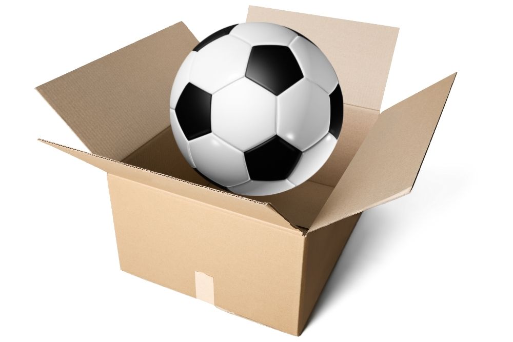 packaging soccer ball into a box