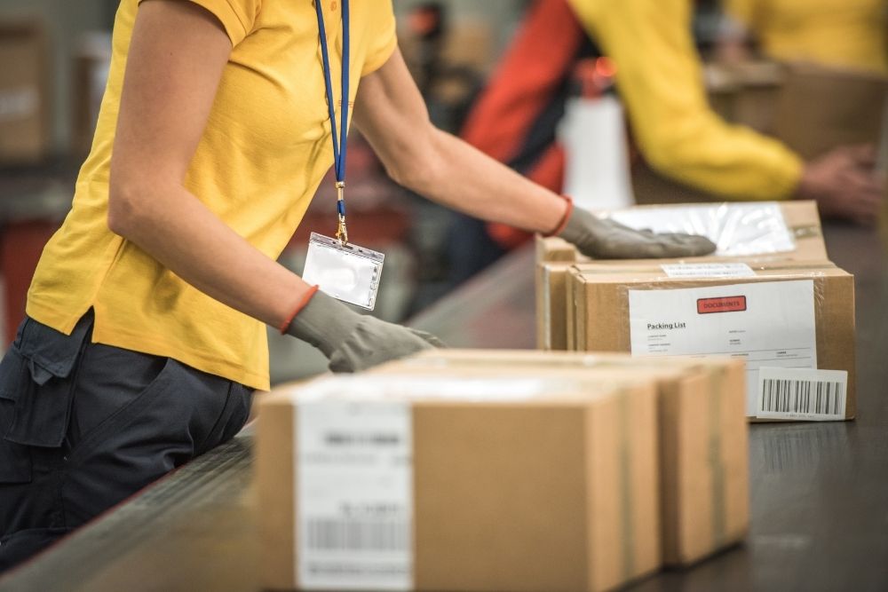 postal worker handling packages