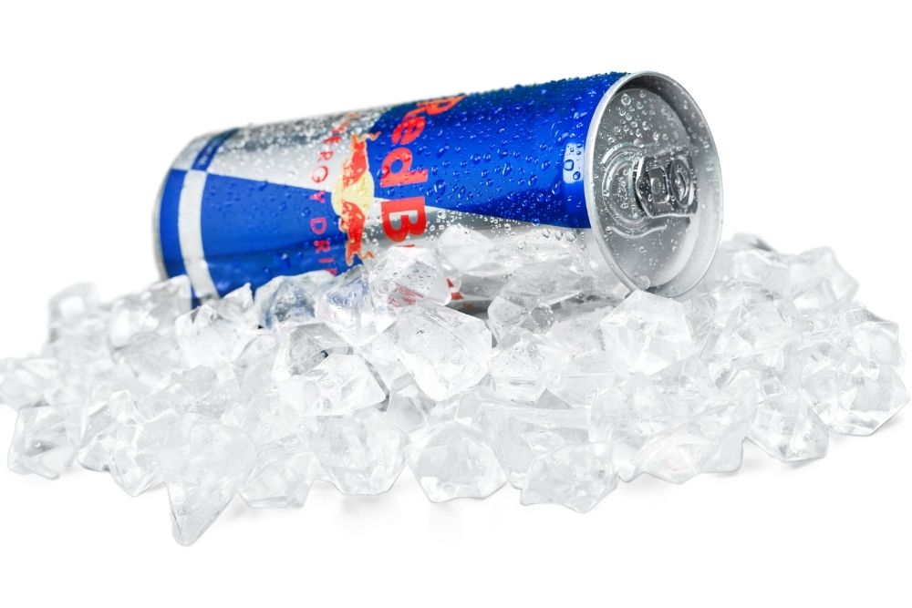red bull and ice cube pile