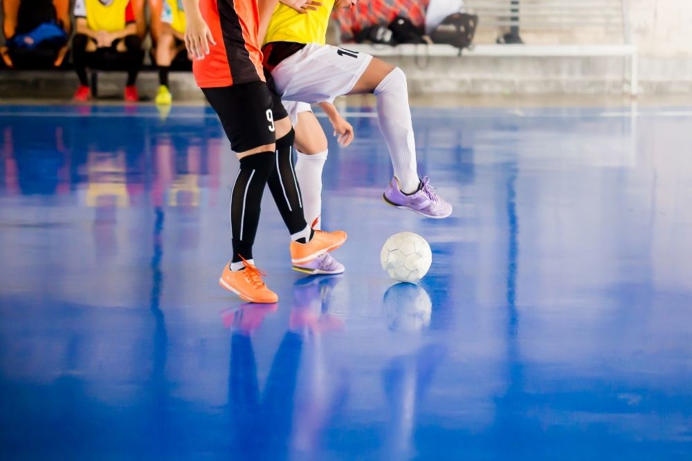 two soccer players in futsal soccer