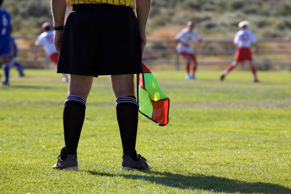 Soccer referee standing on the pitch