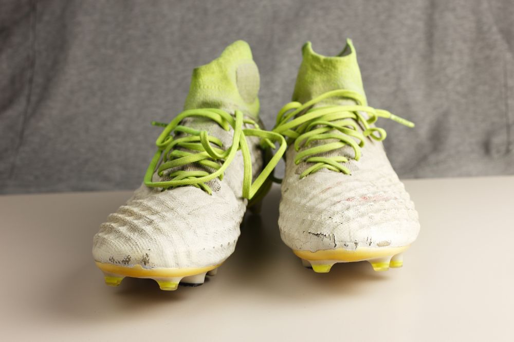 a pair of synthetic soccer cleats