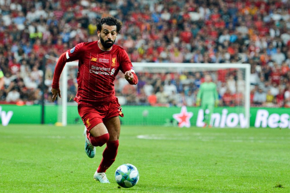 Salah trying to reach the soccer ball in the match
