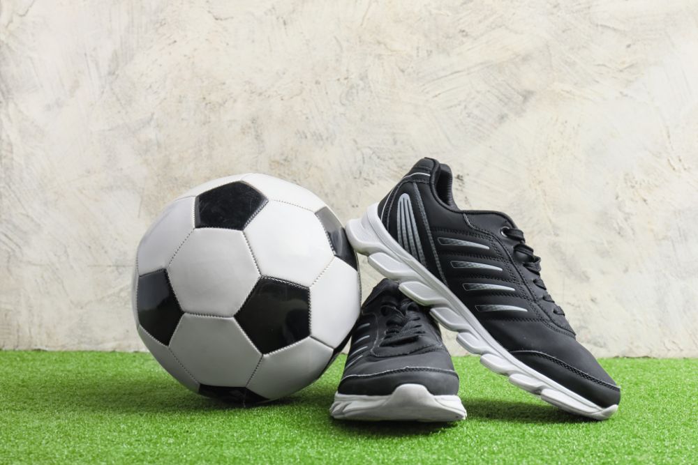 Soccer ball and sneakers