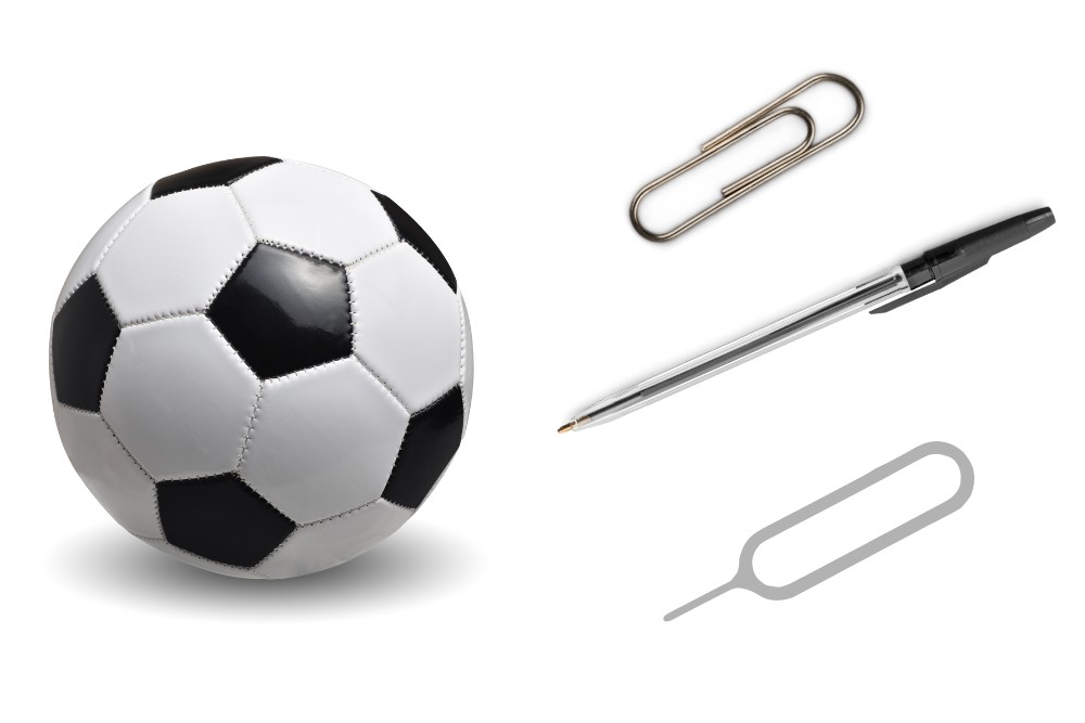 deflate soccer ball with paper clip, pen or sim ejector pin