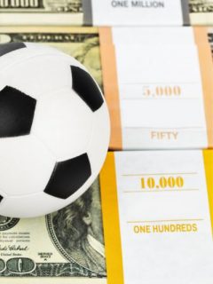 A soccer bal on a lot of money